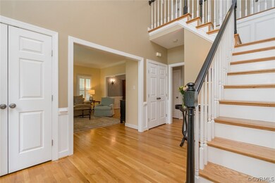 Foyer leads to formal living room,  wood floors  t