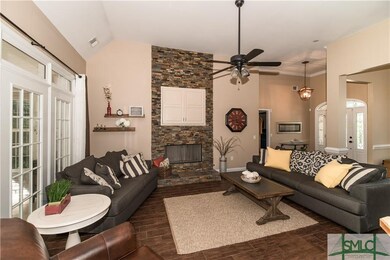 Dramatic tumbled stone fireplace surround with vie