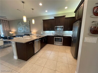 Kitchen featuring appliances with stainless steel
