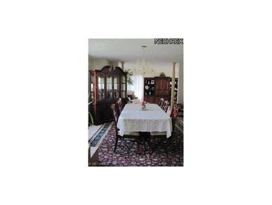 The formal dining room is located off the foyer --