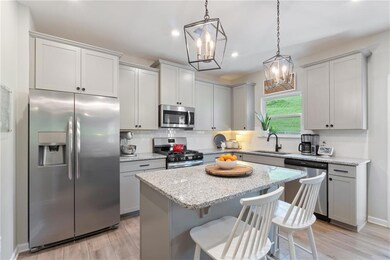 Kitchen with appliances with stainless steel finis