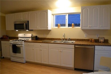 Beautifully renovated kitchen with white cabinets,