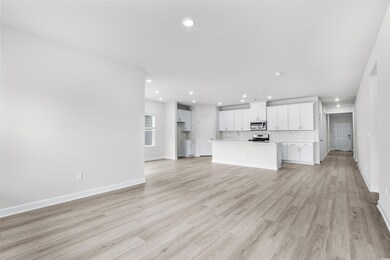 Unfurnished living room with light wood-type floor