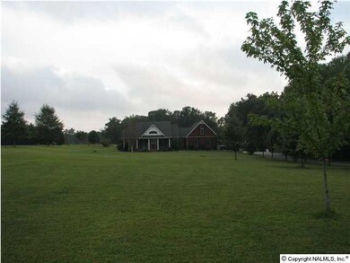 Enjoy 5.15 acres in the country, but close to town!