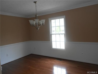 Formal Dining features Crown Molding, Chair Rail, 