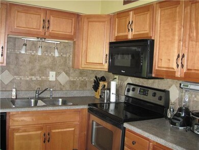 Newer kitchen cabinets with stainless appliances. 