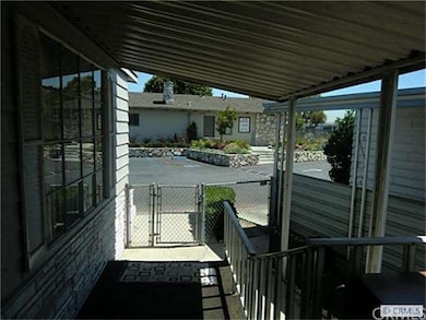 View from front entry porch to clubhouse & pool