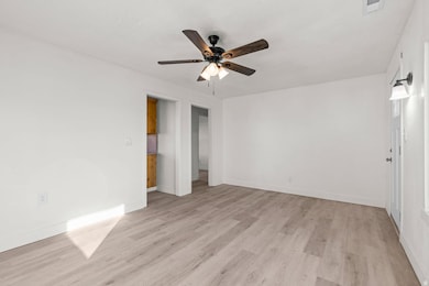 Unfurnished bedroom with light wood finished floors and a ceiling fan