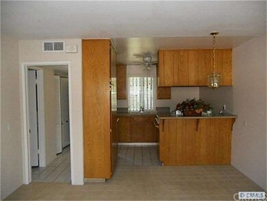 Entry hallway, half bath on left and kitchen/eatin