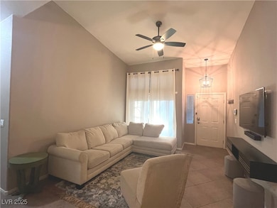 Family room with vaulted ceilings, ceiling fan & light that opens to the dining area and kitchen.