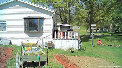 View of side of property with a yard