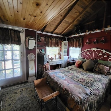 Bedroom with wooden ceiling