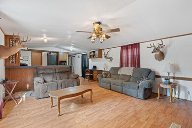 Living area with light wood-style floors, ceiling