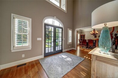 Entry hall with double doors and plantation shutte