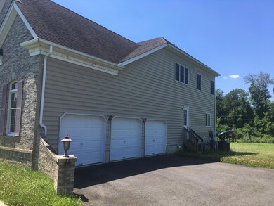 side showing 3 car garage undated