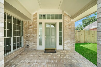 This large covered porch is big enough for a sitting area and all your holiday decorations!