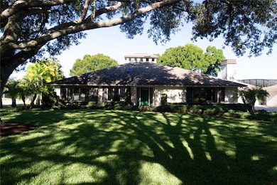 View of front of property featuring a front lawn and a chimney