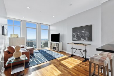 Living room with floor to ceiling windows and hard