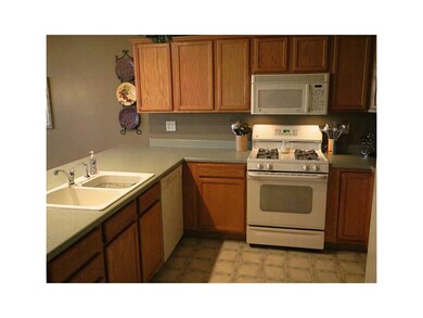 Kitchen. Breakfast bar and gas stove.