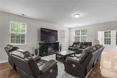 Great Room open to Sunroom