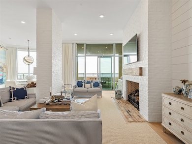 Living room with gas log fireplace and views of th
