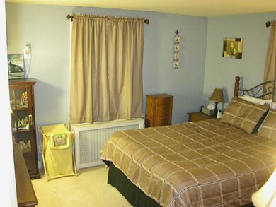 Bedroom. First floor bedroom, hardwoods under carp