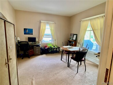 1st Floor Apartment: Front room with windows to th