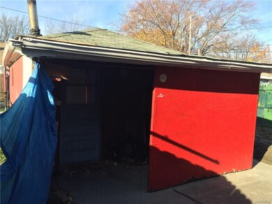 Covered and enclosed patio off garage