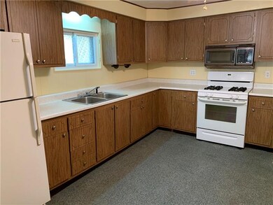 Freshly painted large eat in kitchen with built in