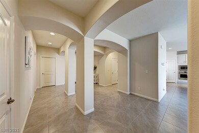 Foyer with ceramic tile floors throughout, carpet