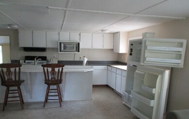 Living room open to kitchen and breakfast bar