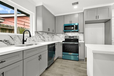 Discover this stylish kitchen featuring sleek gray