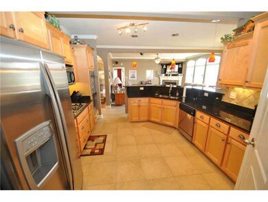Theres plenty of storage space in the Kitchen featuring granite countertops and gas cooktop.