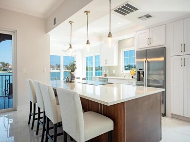 Kitchen with decorative light fixtures, a large is