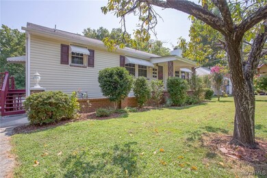 Ranch-style home with a front yard