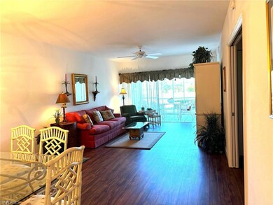 Living room with dark hardwood / wood-style floors
