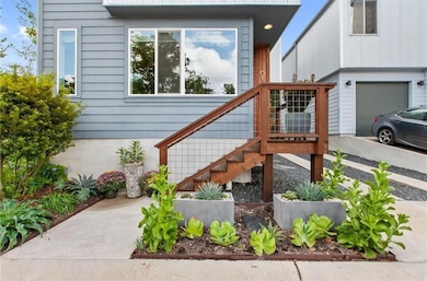 Doorway to property featuring a garage