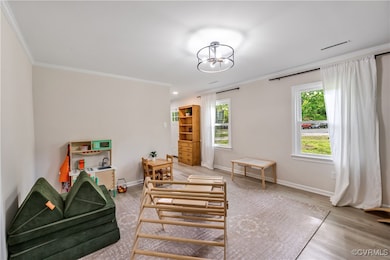 living room featuring light wood-type flooring, cr