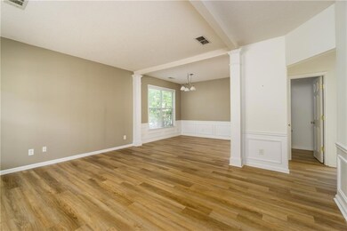 Unfurnished room with light wood-style floors, dec