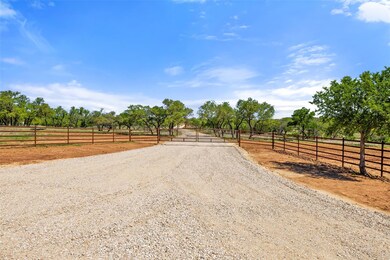View of street featuring a gate, a gated entry, a