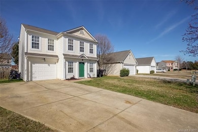 Home features a one car garage with a double car p