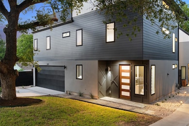 View of front of home featuring a garage, drivewa
