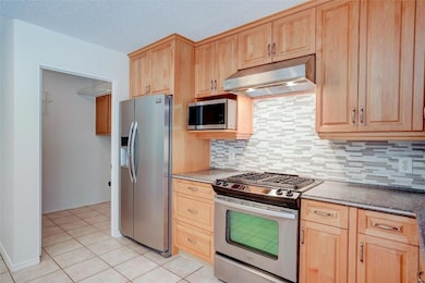 Kitchen featuring appliances with stainless steel