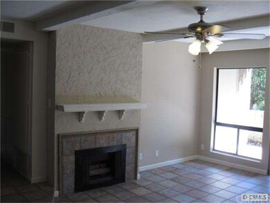 LIVING ROOM WITH NEW PAINT, EXTENSIVE TILE FLOORS 