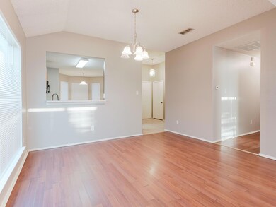 Unfurnished room featuring visible vents, an invit