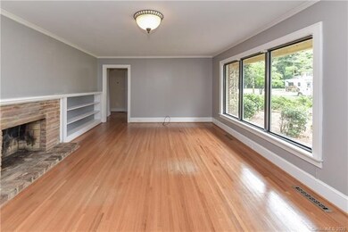 Living Room with Fireplace and Built in Bookshelves