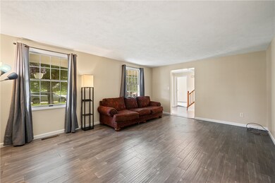 Spacious open living room with newer floor