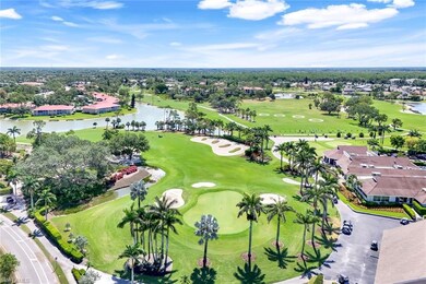 Aerial view of residential area with a large body of water and a local golf course