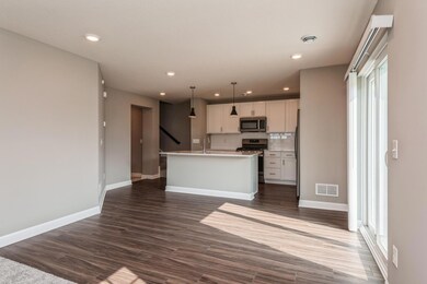 This spacious plan offers plenty of spaces to gather, offering the opportunity to have seating both at the island as well as accommodating a dining room table. *Photos are of another home, colors and finishes may vary.