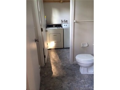 Half bath off the kitchen and laundry room